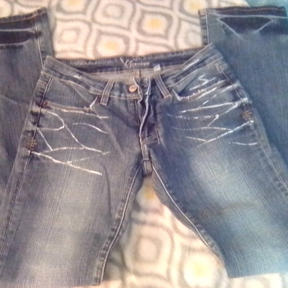 BeBe size 26 denim jeans with diamond bebe design on pockets. New item